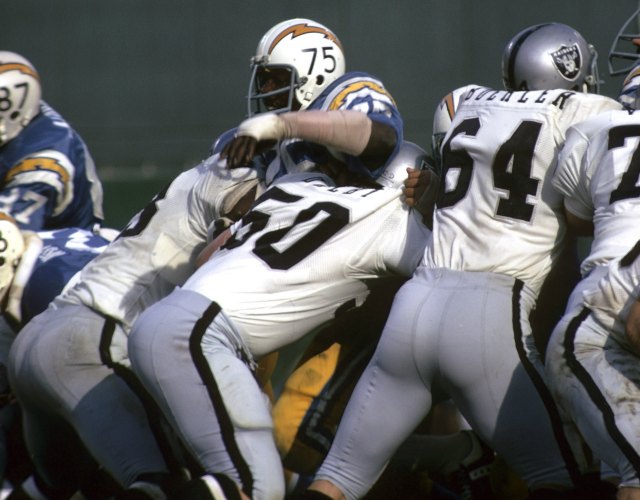 Deacon Jones is double-teamed by Oakland in 1972. (Getty Images)