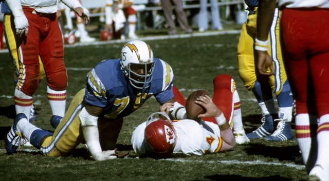 Deacon Jones, in the words of the original caption, levels Ed Podolak in 1972. (Getty Images)