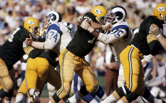 Deacon Jones goes up against Forrest Gregg. (Getty Images)