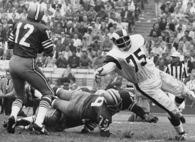 Deacon Jones only has eyes for John Brodie in the late 1960s. (Getty Images)