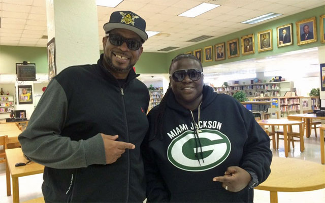Uncle Luke stands with Lakatriona Brunson, who will make Florida high school football history. (David Furones/Twitter)