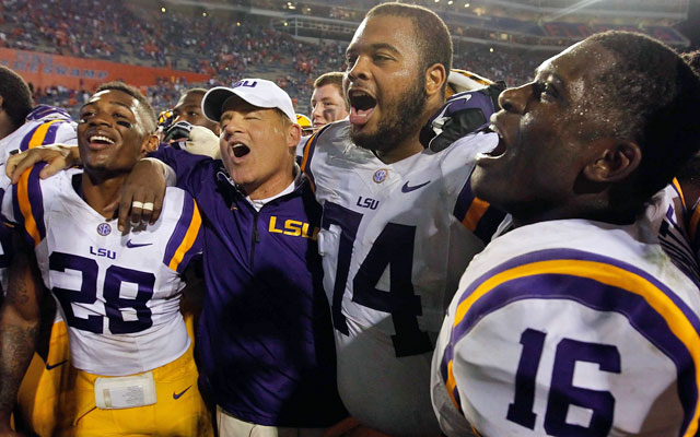 How many karaoke machines could Les Miles afford on his SEC West salary? (USATSI)