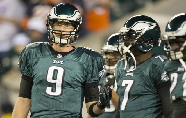 The Philadelphia Eagles' Nick Foles (9) congratulates Michael Vick (7)  after a touchdown drive against the Carolina Panthers during the second  quarter in preseason action at Lincoln Financial Field in Philadelphia,  Pennsylvania