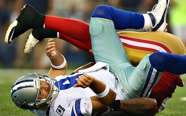 Tony Romo was beaten up by the 49ers defense Sunday. (Getty Images)