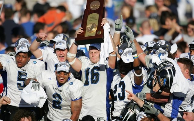 Cullen Finnerty (No. 16) lifts the 2006 Division II national championship trophy. (USATSI)