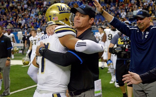 Jim Mora gives Brett Hundley a hug after the quarterback's final UCLA game. (USATSI)