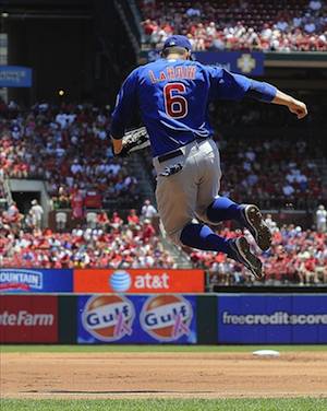 Chicago Cubs players click their heels in honor of Hall of Fame player Ron  Santo as they take the field during Ron Santo Day before a baseball game  against the St. Louis