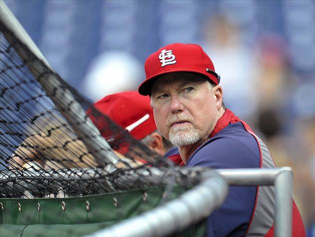 St. Louis Cardinals manager Mike Matheny and Mark McGwire watch