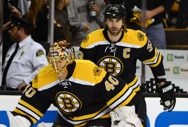 Boston Bruins player Shawn Thornton brings the Stanley Cup to