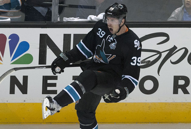 Logan Couture is obviously happy with his new deal in San Jose. (USATSI)