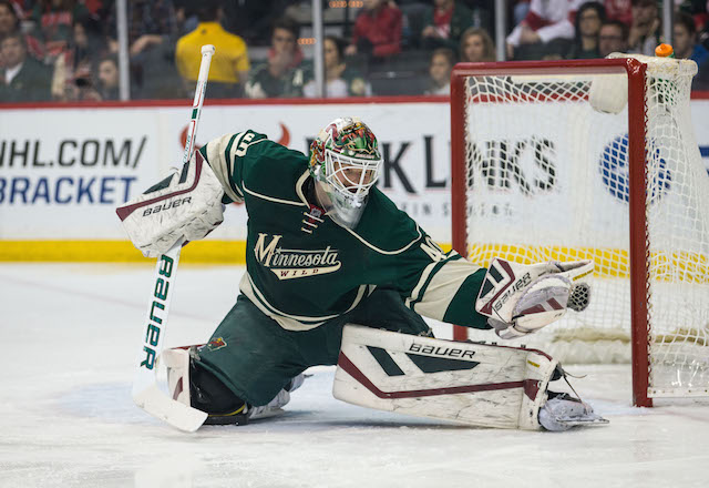 Minnesota Wild' goalie Devan Dubnyk warms up as players wore