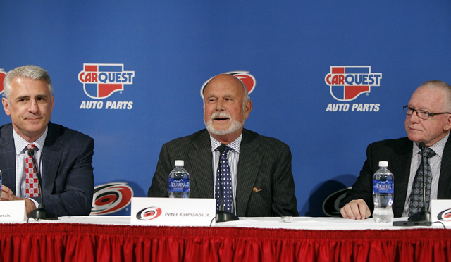 Peter Karmanos (center) had some harsh words for his former GM, Jim Rutherford (right). (Getty Images)