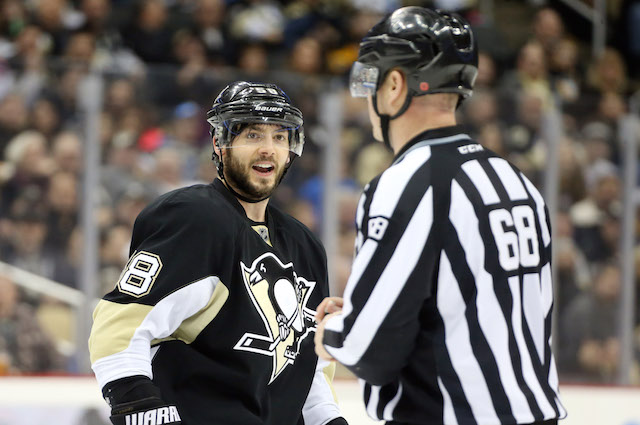 Kris Letang lost his stick, so he tried to take one from his opponent. (USATSI)