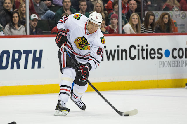 Marian Hossa of the Chicago Blackhawks holds up the Stanley Cup