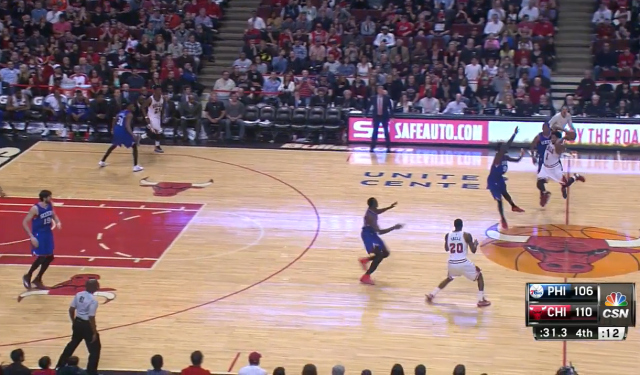 Derrick Rose somehow makes the play.