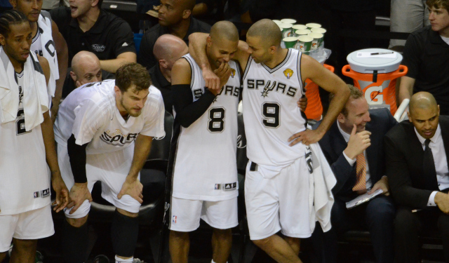 Patty Mills and Tony Parker celebrate as the 2013-2014 season ends.