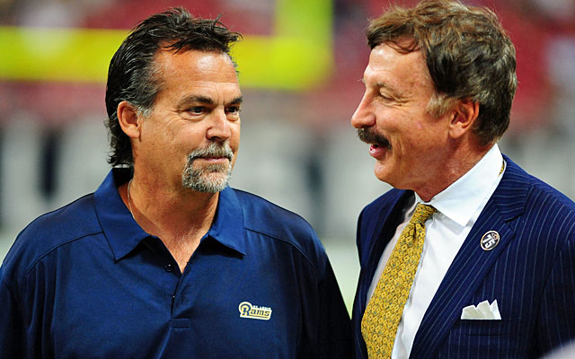 Rams owner Stan Kroenke (right) talks with coach Jeff Fisher prior to the Cardinals game. (Getty)