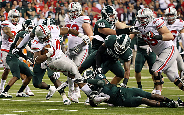 Michigan State defenders take down Ohio State running back Carlos Hyde. (USATSI)