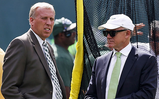 Jets GM John Idzik (left) and owner Woody Johnson are gearing up for a coaching search. (Getty)