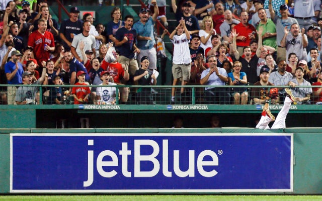 The Red Sox faithful watch Mookie Betts disappear over the wall Tuesday. (USATSI)