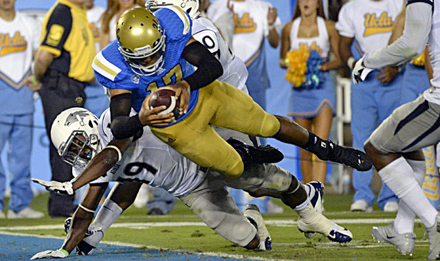 UCLA quarterback Brett Hundley dives into the end zone in a romp over Nevada. (USATSI)