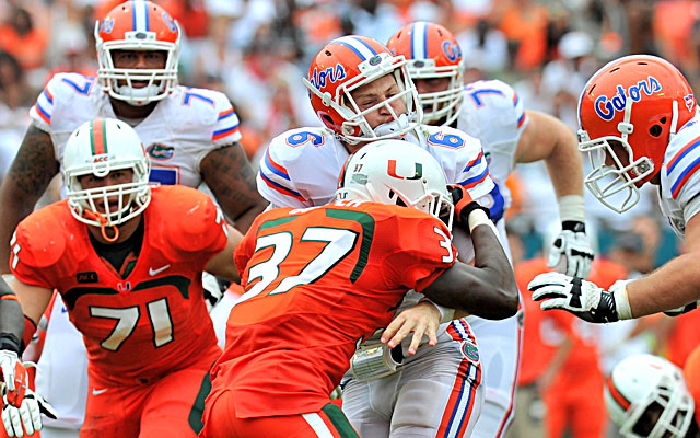Miami's defense puts all kind of pressure on Florida quarterback Jeff Driskel during its big win. (USATSI)