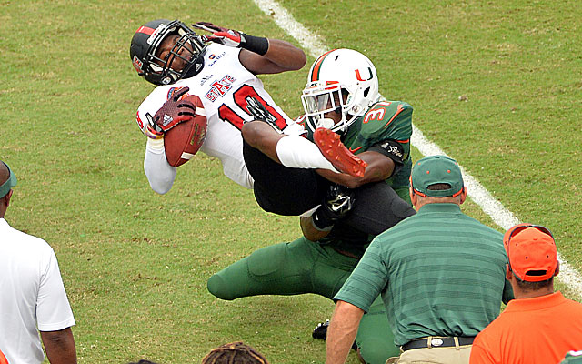 Booker T. Mays, who also plays receiver for Arkansas State, drops this pass against Miami.  (USATSI)