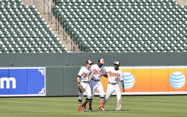 Orioles outfielders celebrated after the final out as usual.