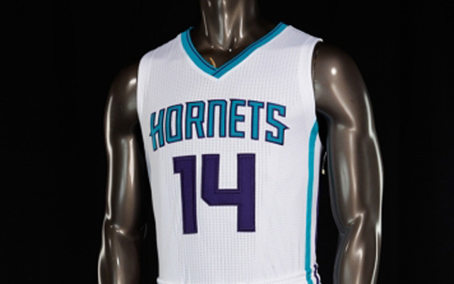 The Hornets' new uniforms don't have the logo on the front.  (USATSI)