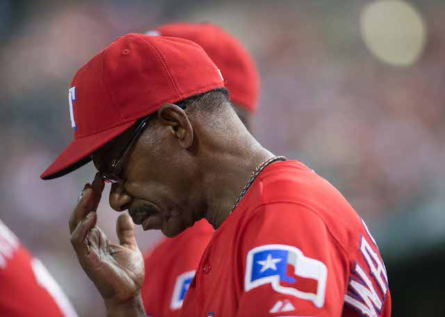 Texas Rangers manager Ron Washington, front right, greets Adrian