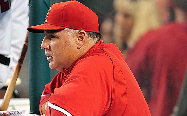 Manager Mike Scioscia of the Anaheim Angels holds the World Series News  Photo - Getty Images