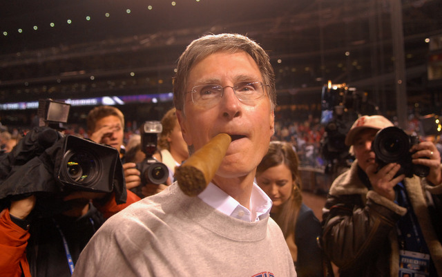 John Henry, seen here celebrating the 2007 World Series, has agreed to buy the Boston Globe.