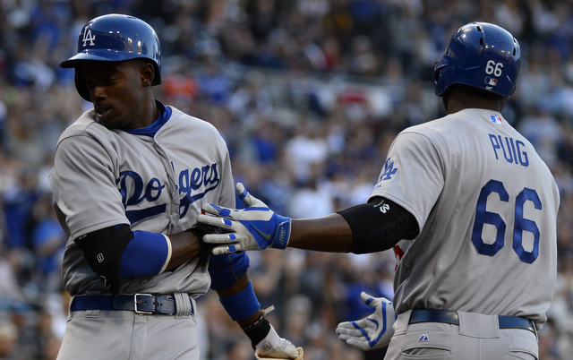 The Dodgers lost both Dee Gordon (l.) and Yasiel Puig to hip problems on Saturday.