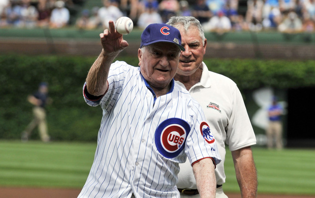 Lennie Merullo, seen here throwing out the first pitch in 2014, has passed away.