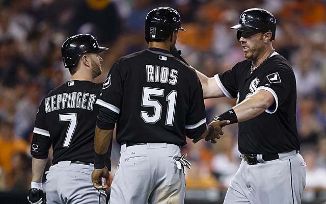 Alex Rios and his teammates celebrate their big offensive night.