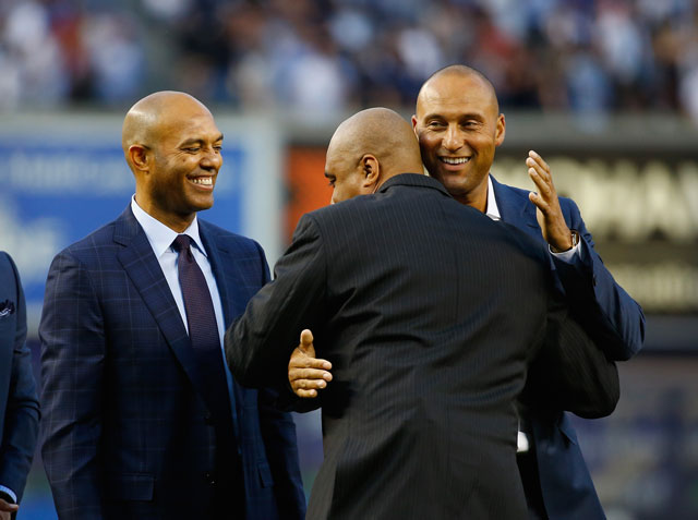 Bernie Williams (left) and Derek Jeter congratulate each other