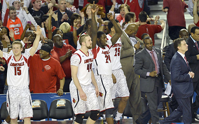 Playing it cool, Rick Pitino (right) believed in his Cards to make a run, and they came through. (USATSI)