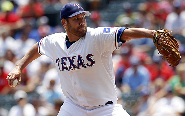 Colby Lewis is sticking with the Rangers.