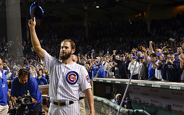 Cubs fans salute Arrieta for being the first Cubs pitcher with 20 wins since 2001.