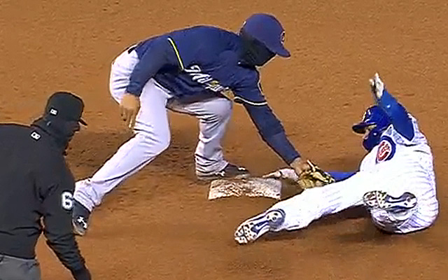 Baez eludes the tag at second.
