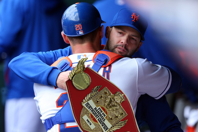 Dillon Gee grabs a hug with his title belt. 