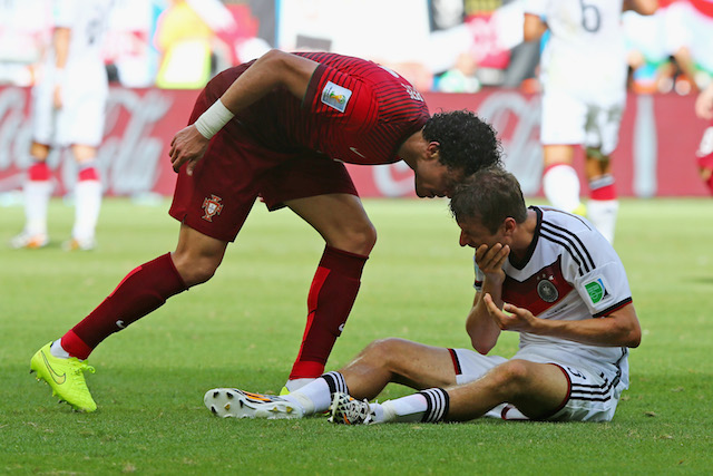 Possible turning point of Group G: Pepe headbutting Thomas Muller and earning a red card. (Getty Images)