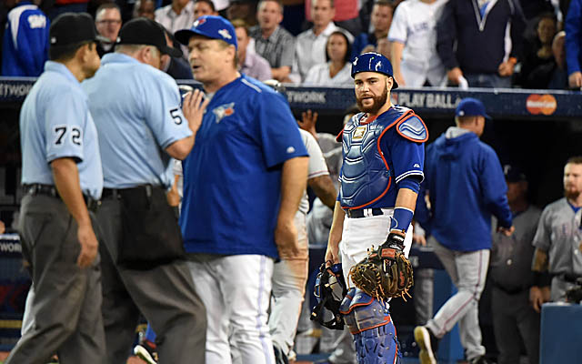 Russell Martin looks on while the umpires sort out the situation with John Gibbons.