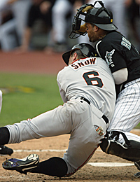 Florida Marlins catcher Ivan Rodriguez tags out San Francisco Giants J.T.  Snow to end the game, Marlins pitcher Ugueth Urbina watches, as the Marlins  beat the Giants at Pro Player Stadium, to