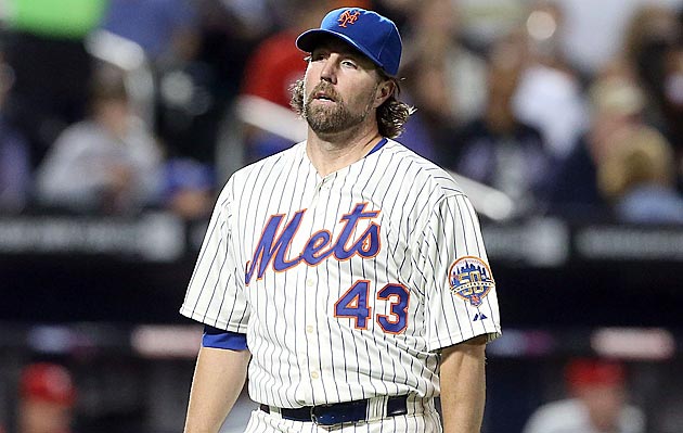 New York Mets pitcher R.A. Dickey delivers a knuckleball pitch in