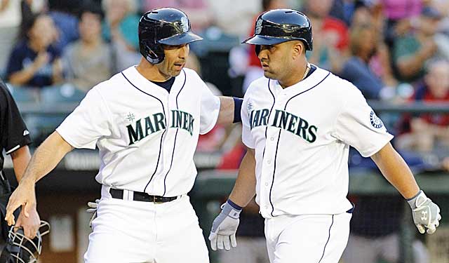 Torrid Raul Ibanez congratulates almost-as-hot Kendrys Morales after a homer. (USATSI)