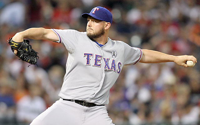 The Rangers are glad to have insurance on Harrison, but they'd rather have him healthy and on the mound. (USATSI)