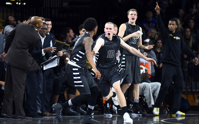 Oakland's Max Hooper (10) celebrates with his teammates earlier this season. (USATSI)