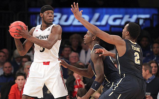 Justin Jackson (left) and the Bearcats stand up to Pittsburgh and win at Madison Square Garden.