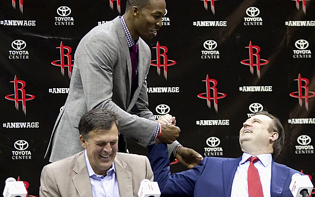 Dwight Howard greets GM Daryl Morey, who put together deals over two years that netted him his center. (Getty Images)